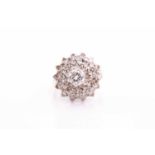 A diamond cluster dress ring; the four tiers of round brilliant cut diamonds in claw mounts and