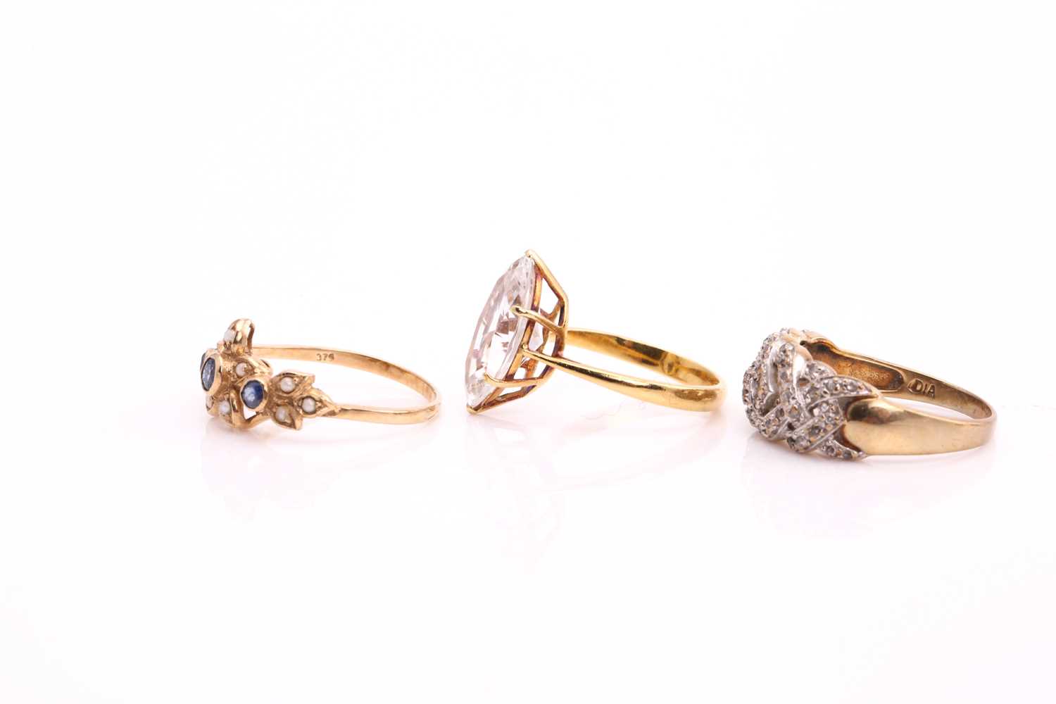 A lot consists of three rings, one comprises a marquise cubic zirconia, claw set on an 18ct yellow - Image 3 of 3