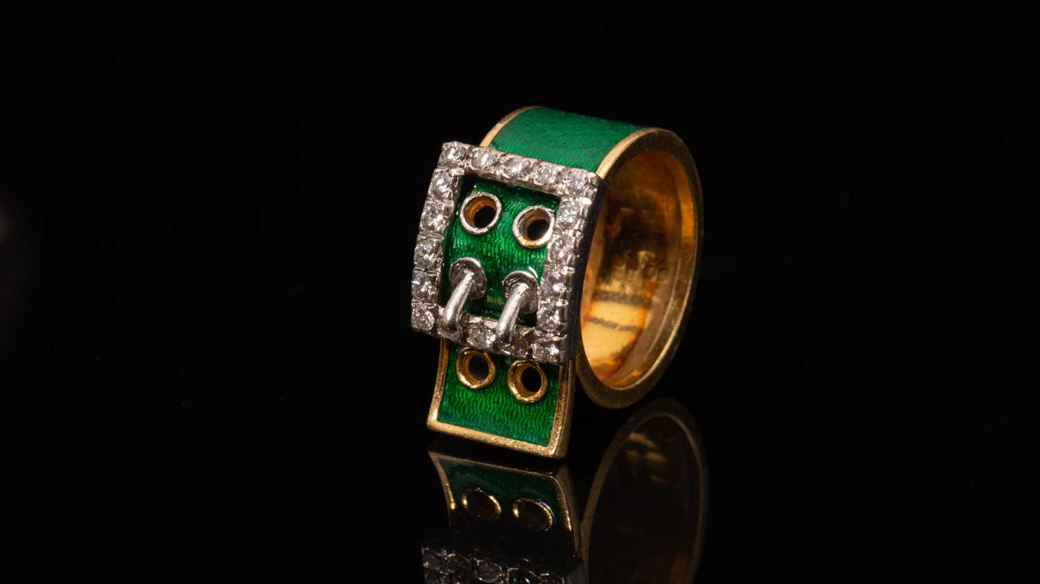 A Kutchinsky enamel and diamond-set belt buckle ring, consisting of eighteen round brilliant