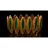 A Kutchinsky enamelled and textured 18ct gold link bracelet, consists of green enamel panels on