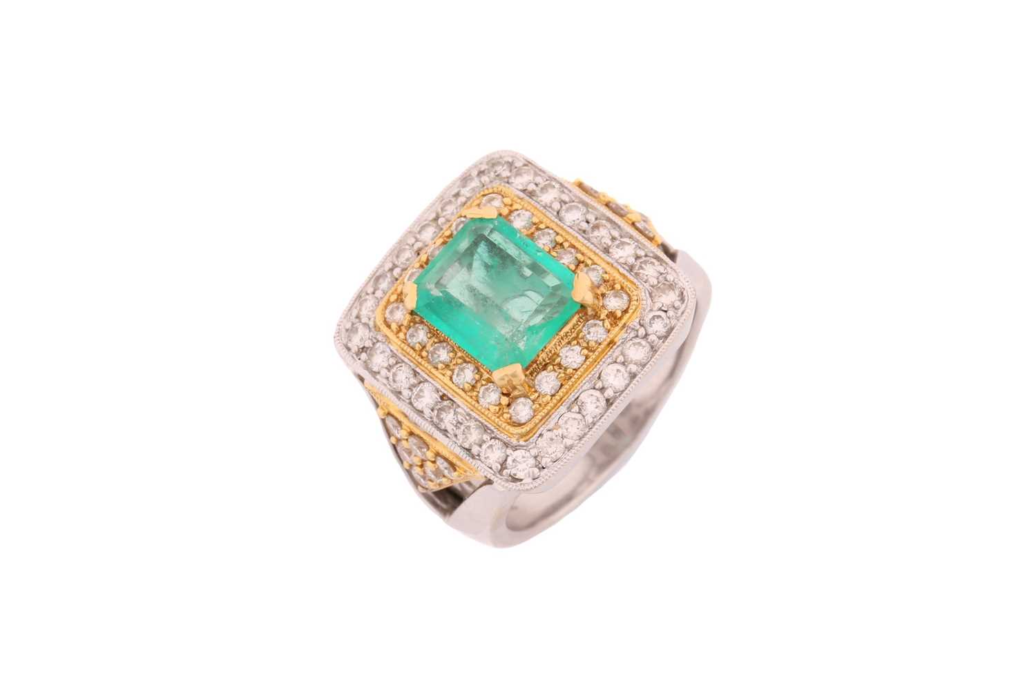 An emerald and diamond three-tier dress ring, consisting of a central emerald-cut emerald,