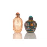 A Chinese rose blush glass snuff bottle, decorated in relief with auspicious Buddhist symbols,