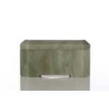 A jade box and cover, of rectangular form with canted corners, on short bracket feet, 11cm wide, 5.