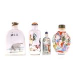Four Chinese porcelain snuff bottles, 20th century, one moulded with numerous boys and men amongst