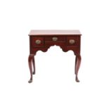 A George II/III mahogany kneehole lowboy with moulded top above one frieze and two flanking drawers.