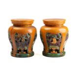 A pair of Chinese pottery Sancai vase stands/garden seats, mid 20th century, the circular tops above