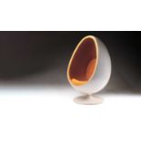 An Eero Aarnio style "Egg Pod" chair with white plastic shell the interior trimmed in volcanic