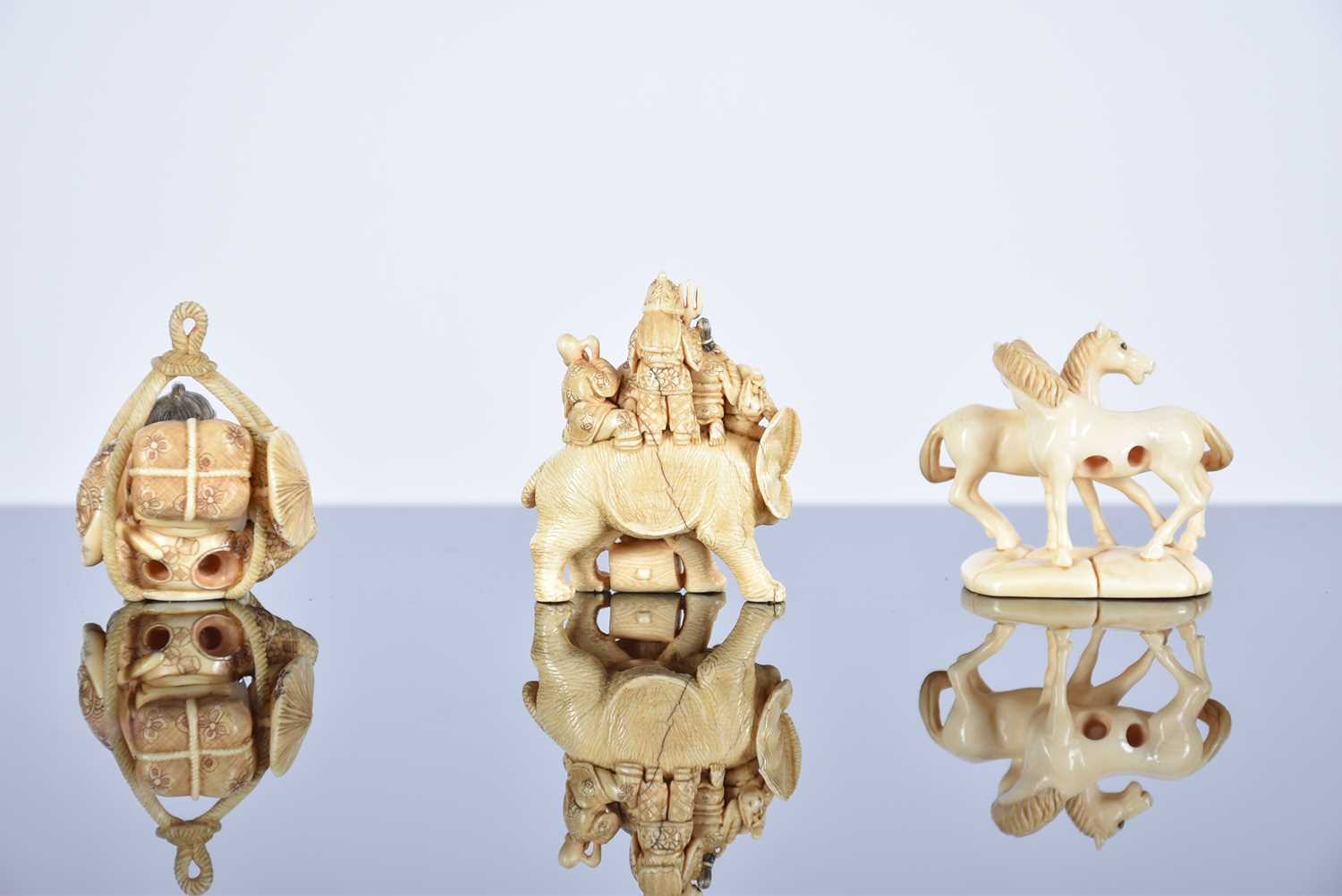 Three Japanese ivory netsukes, Meiji period, comprising the seven gods of good fortune upon an - Image 2 of 11