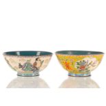 A Eastern enamel circular bowl decorated on a yellow ground and reserves of colourful exotic birds