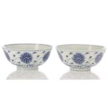 A pair of Chinese blue & white lotus bowls, early to mid 20th century, the interior with a single