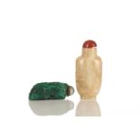 A Chinese chicken bone jade snuff bottle, carved in relief with a flowering tree; and a malachite