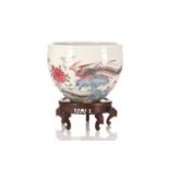 A Chinese Yongzheng style famille rose jardiniere, painted with two Fenghuang, with rockwork, tree