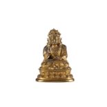 A Chinese gilt bronze figure of Bodhisattva, the right hand in vitarkamudra, seated on a double