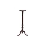 A George III style mahogany pillar torchere with dish top and tripod base, 122 cm highNo apparent