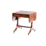 An unusually small George IV mahogany two flap sofa table with single frieze drawer on end stile