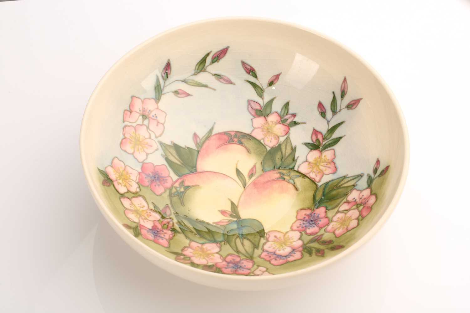 A limited edition Moorcroft fruit bowl, late 20th century, decorated with apples, flowers and leaves