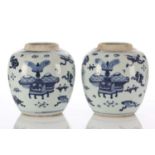 A pair of Chinese blue & white ginger jars, Qing, painted with antiques amongst Buddhist symbols,