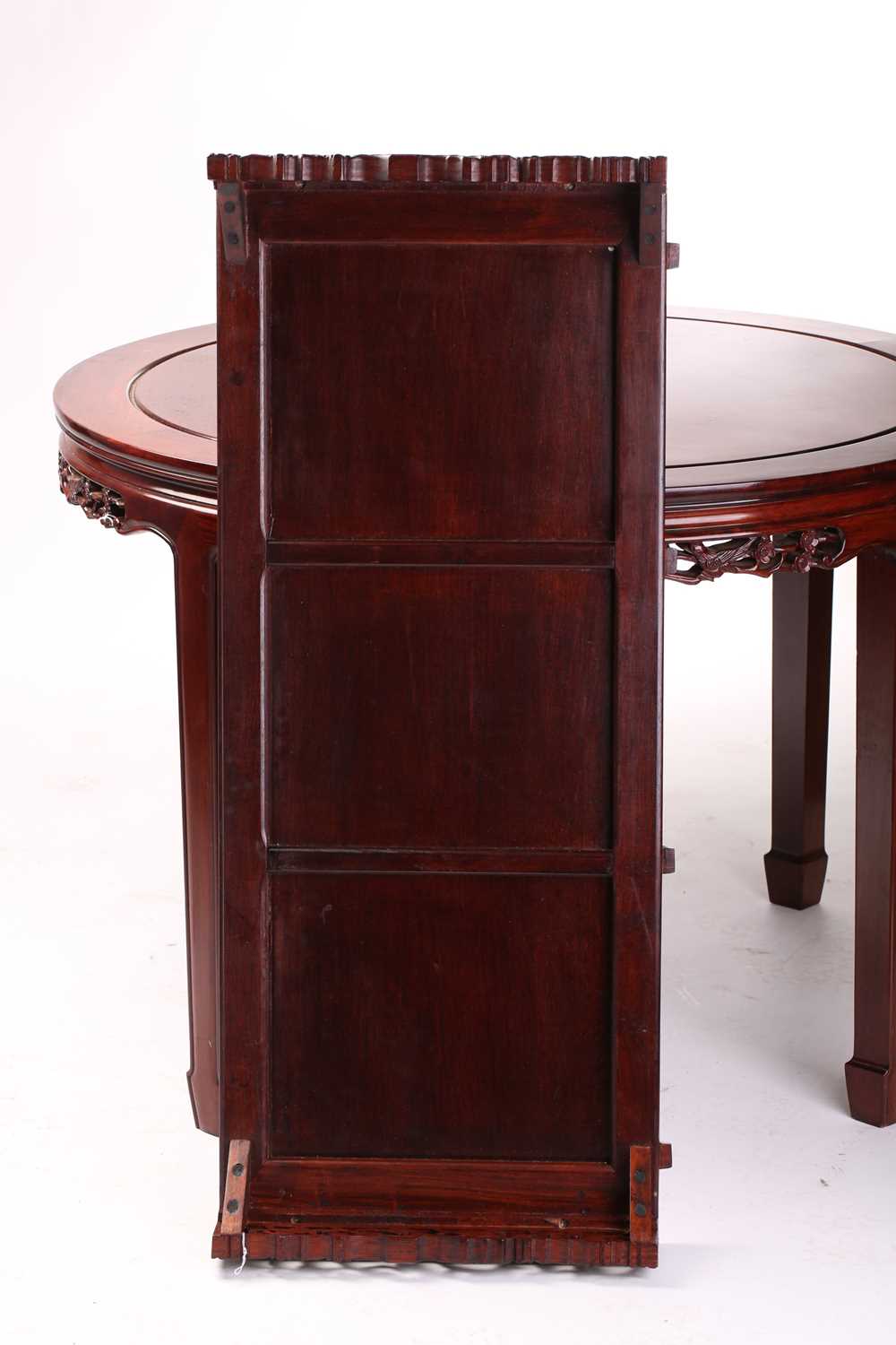 A 20th-century Chinese padouk wood extending circular dining table with single leaf insert and six - Image 2 of 10