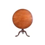 A George III 'Cuban Mahogany' circular tilt-top tripod table, with birdcage movement above bold