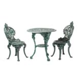 A Coalbrookdale style heavy cast iron circular garden table and pair of matching spoon back chairs