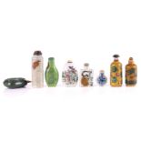 A collection of eight Chinese porcelain snuff bottles, 20th century, comprising a floral and