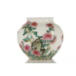 A Chinese famille rose vase, painted with chrysanthemums and rocks, a poem verso, apocryphal