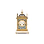 A French gilt metal and champleve enamel mantel clock, 19th century, with turned finials and