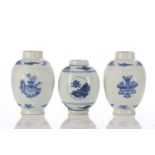 A near pair of Chinese blue & white caddies, of barrel form, the rib moulded bodies with
