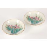 A pair of Chinese porcelain sauce dishes, 20th century, each finely painted with a lotus flower