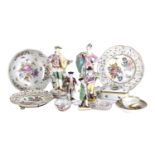 A collection of European porcelain including a pair of 18th-century lady and gallant in colourful