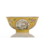A Chinese yellow ground bowl, 20th century, painted with medallions of goats by blossoming trees