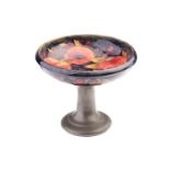An early 20th century Moorcroft tall tazza in the Pomegranate pattern, on Tudric pewter stand
