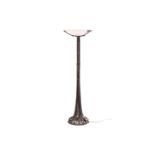 A free-standing Art Deco style oxidized wrought iron and alabaster uplighter with a circular