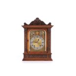 An early 20th-century oak cased 8-day mantle clock of architectural form by Winterhalder &
