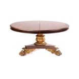 A 19th-century American rosewood extending circular dining table with geared undercarriage over a