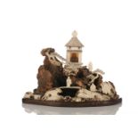 A Buddhist monk island of devotion, late 19th century, the carved burr wood mountain with ivory