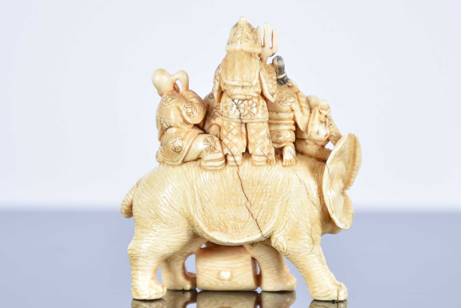 Three Japanese ivory netsukes, Meiji period, comprising the seven gods of good fortune upon an - Image 4 of 11