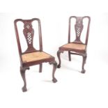 A pair of 18th century American, Pennsylvanian 'Queen Anne' red walnut side chairs, the splats
