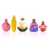 Five Chinese Peking glass style snuff bottles, 20th century, four with glass overlaid decoration