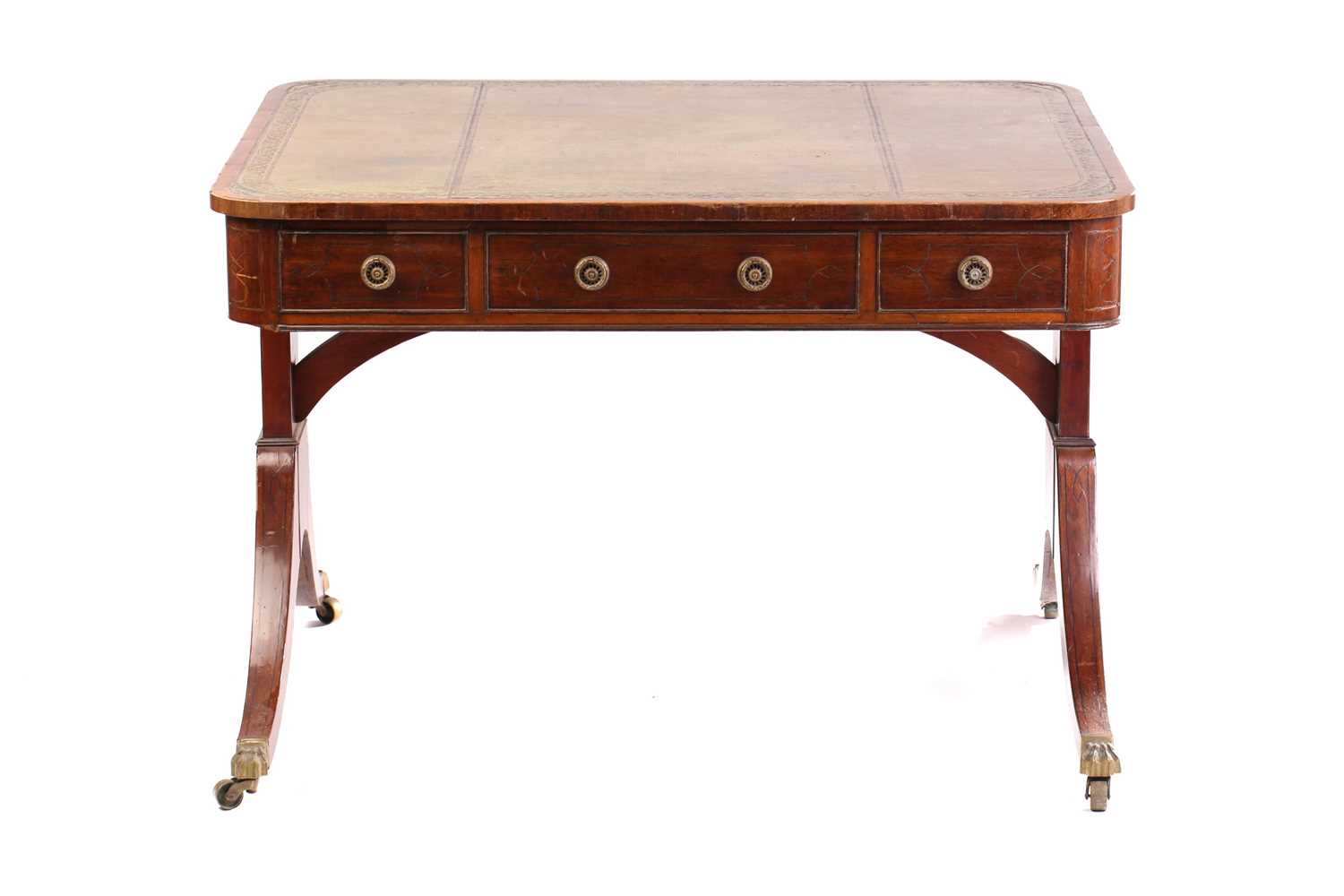 An unusual George IV ebony strung library table with crossbanded and tooled leather inset top with