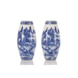 A pair of Chinese blue & white ovoid vases, painted with figures before buildings and a