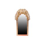 A late 19th century carved lacquered and gilt arch-topped wall mirror with a cresting pierced and