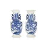 A pair of Chinese blue & white hexagonal vases, painted with figures heading towards a mountain