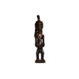 A Songye hermaphrodite power figure (Nkisi), Democratic Republic of Congo, twentieth century, the