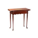 An early George III oak fold-over gaming table with "Penny Round" corners, the top inset with a