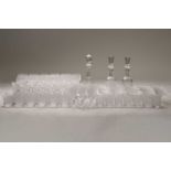 An extensive suite of Waterford Alana pattern drinking glasses, comprising a pair of decanters, 18 x