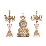 A late 19th-century Vincenti et Cie gilt metal and "Pompadour" pink porcelain three-piece clock