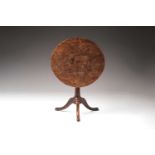 An unusual George III vernacular burr elm circular snap-top tripod table on turned "Gun Barrel"
