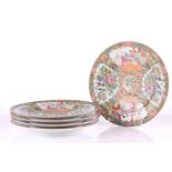 Five Chinese Canton famille rose plates, late Qing - early 20th century, painted with panels of