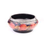 A Moorcroft Pomegranate pattern fruit bowl with silver plated rim, 18 cm diameter to the top x 10 cm
